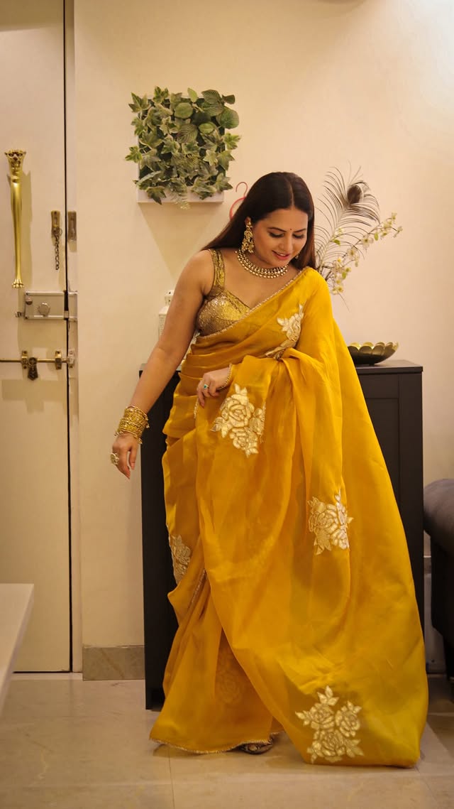 Here’s what I wore for my friend’s wedding reception ✨Exquisite dreamy organza yellow saree with gold lotus gota work 🌼Lightweight, elegant & absolutely perfect for a summer celebration 💛Saree @chinayabanaras [organza silk saree, yellow golden gota work, sareereels, wedding season, summer, saree love, saree series , explore, fyp, Chinayabanaras, dhurandhar, desi outfit, saree lover, Indian outfits, saree styling]#explorepage #trendingreels #saree #fyp #viralreeĺs by @fashion_enthusiast_sr