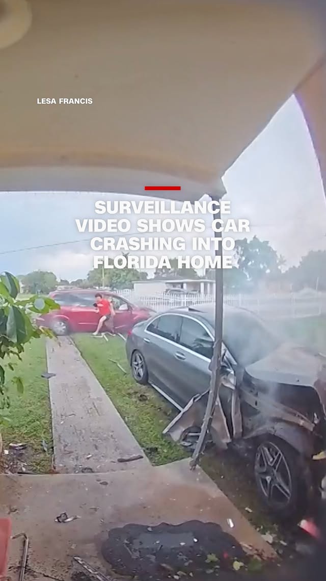 Surveillance video shows two vehicles colliding before one crashed into a home in Miami-Dade County, Florida.