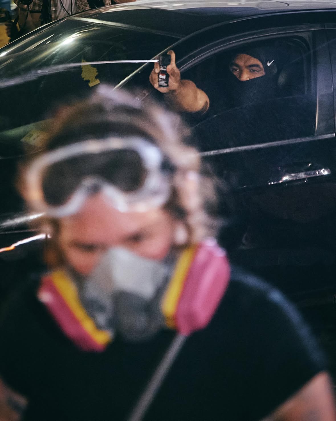 Masked personnel who emerged from the Delaney Hall detention center sprayed protesters gathering in front of the gates outside the facility on Friday, June 5 in Newark, New Jersey.