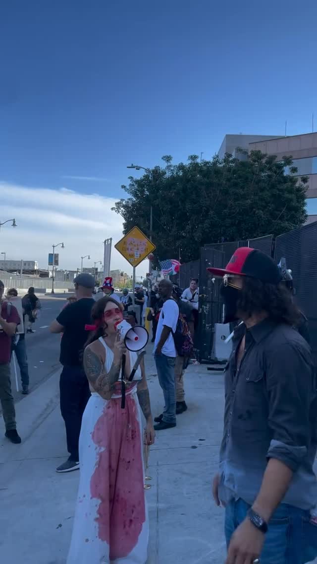 📸: Left-wing protestors pour a liquid, presumably gasoline, on Jon Mellis, a Conservative activist and pardoned January 6th rioter outside the Edward R. Roybal Federal Building in Los Angeles.